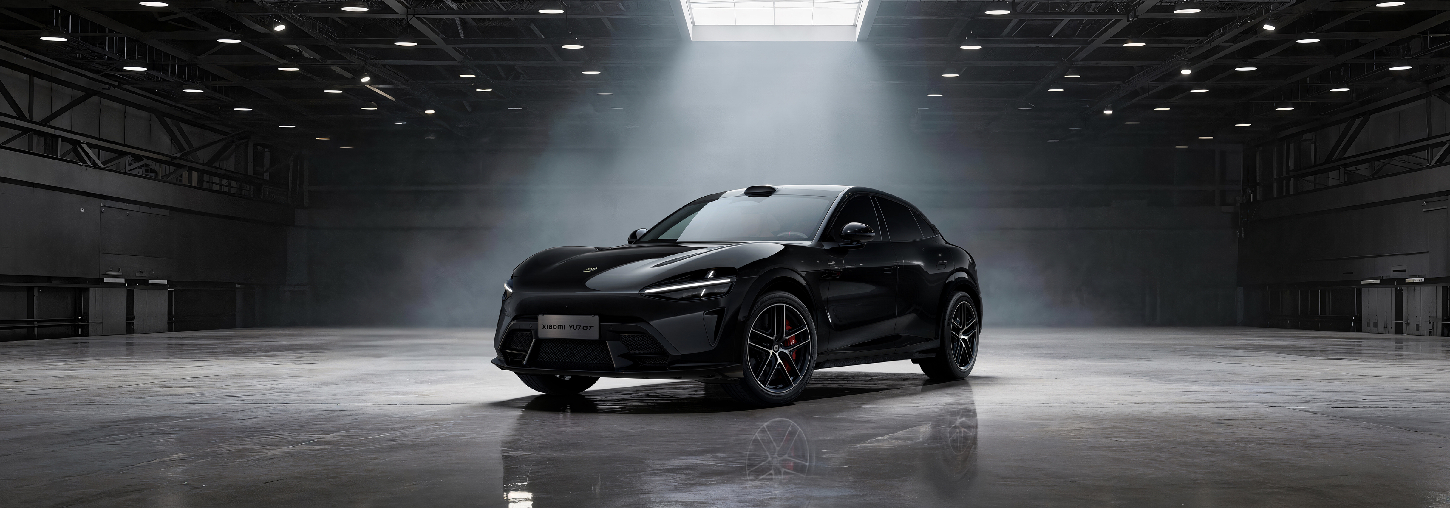 A black sports car is parked in a spacious garage, the surrounding environment is dimly lit, with only the top lights illuminating the space, and the car's body reflects a faint sheen.