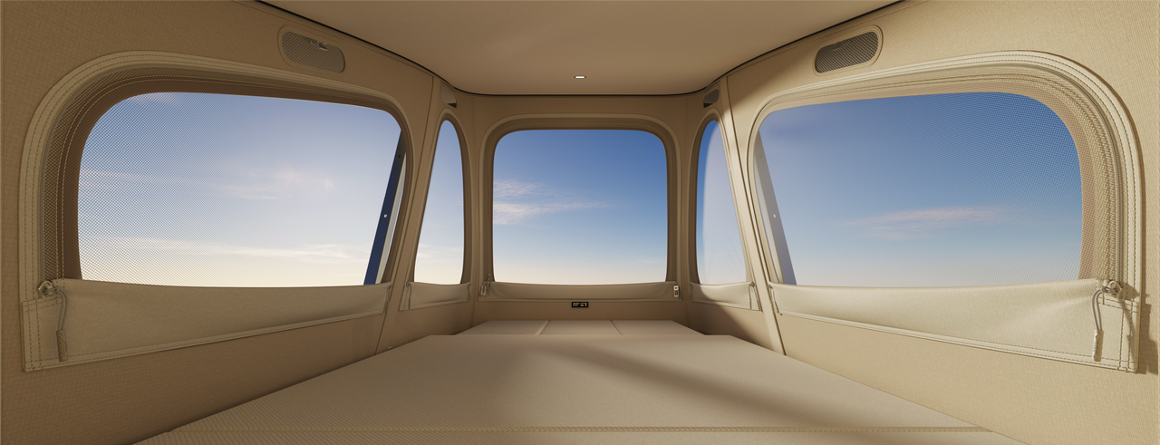 The interior space is showcased with multiple windows, through which the blue sky can be seen. The walls and floor present a warm beige color, making the space simple and bright, suitable for placing beds and other furniture.