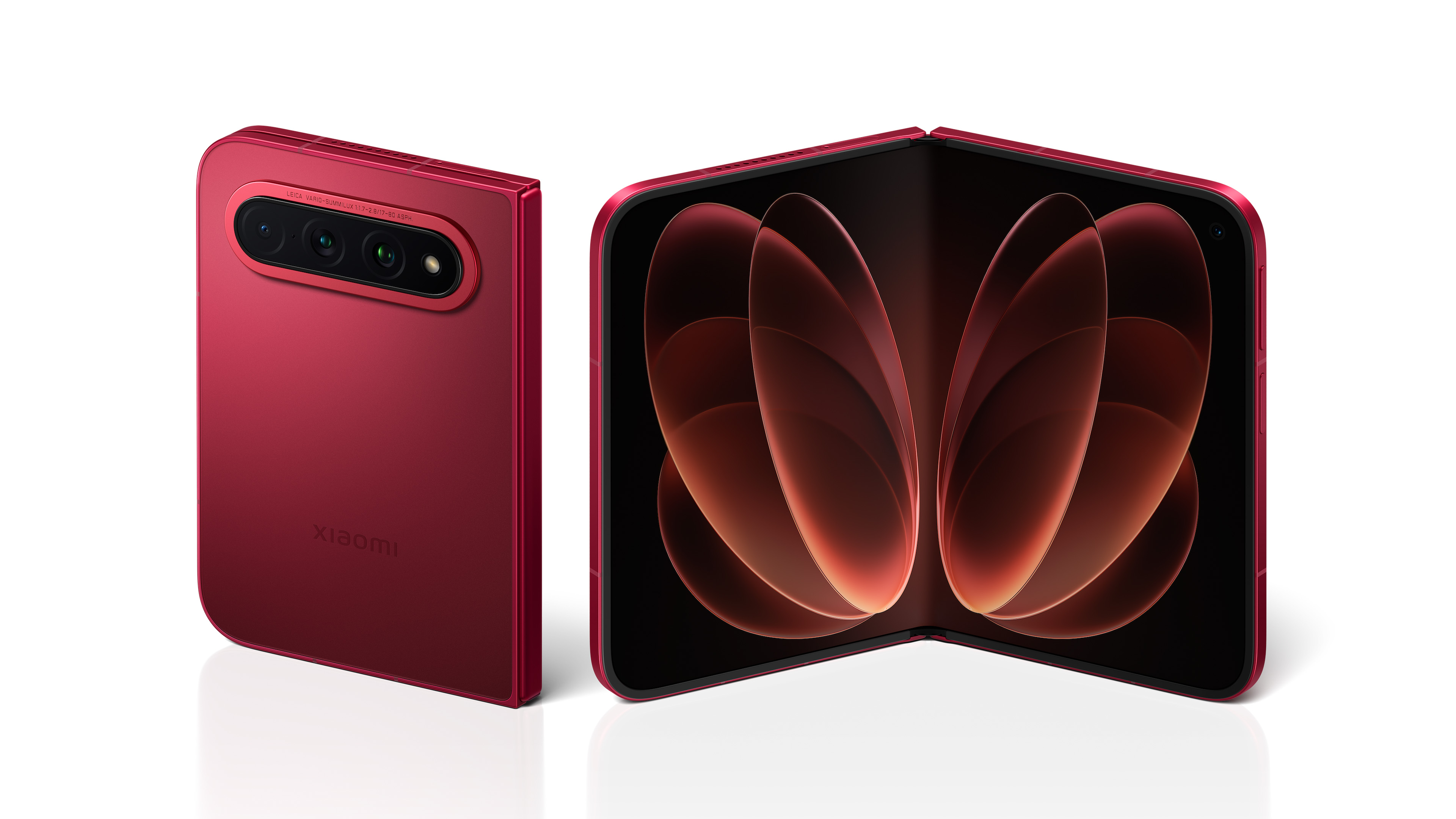 A red folding phone is displayed in the foreground, with the phone in an open state showcasing a large screen. The back features three cameras and the brand logo. The overall design is modern and vibrant in color.