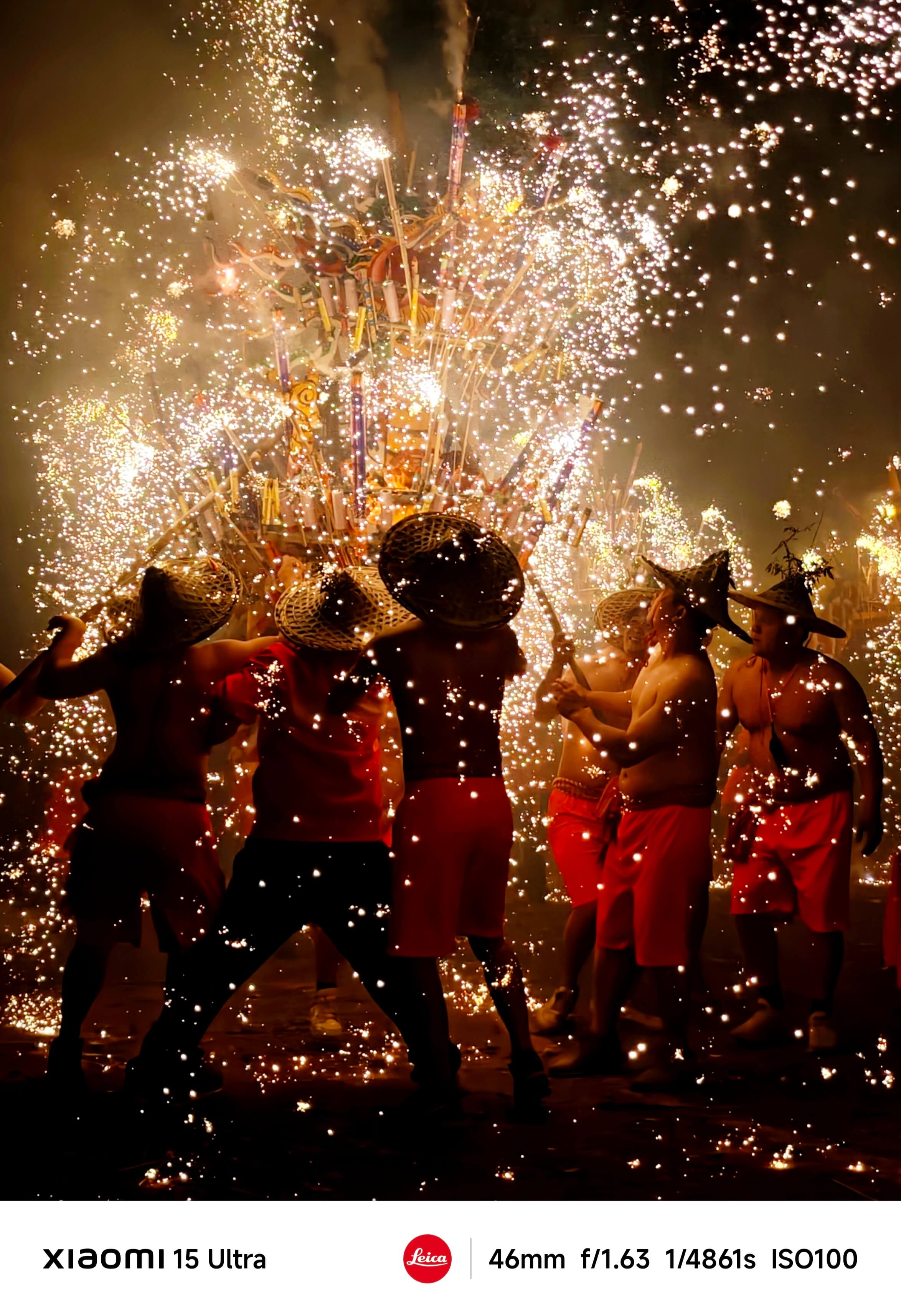 People are wearing red shorts and straw hats, holding sparking fireworks in the smoke, participating in the celebration.