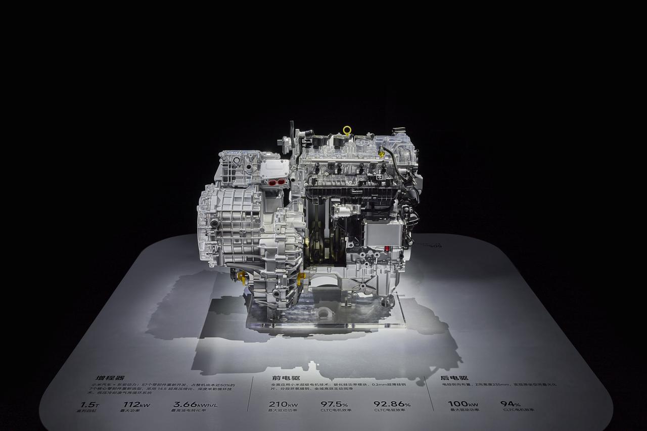 An image of a car engine is displayed, with the engine set against a black background. At the bottom, there is a white display stand that features relevant technical specifications and performance data.